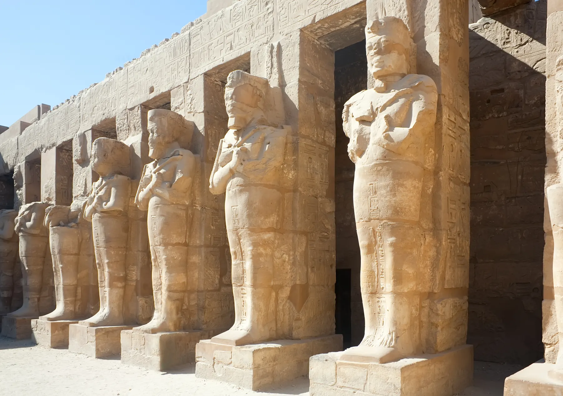 A row of monumental statues at Karnak Temple